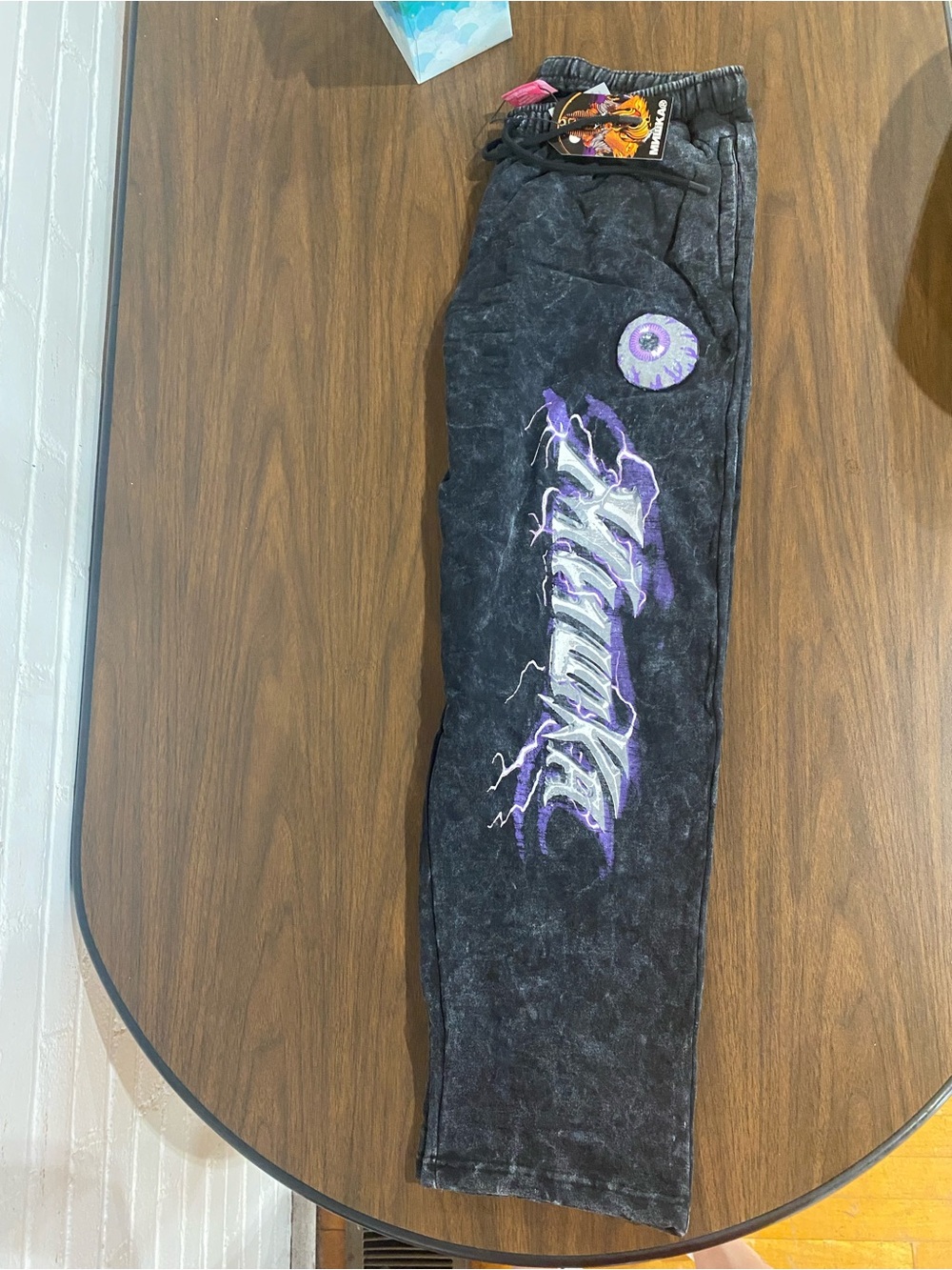 Mishka  Black Mineral Wash Sweatpants with Purple Eyeball Graphic
